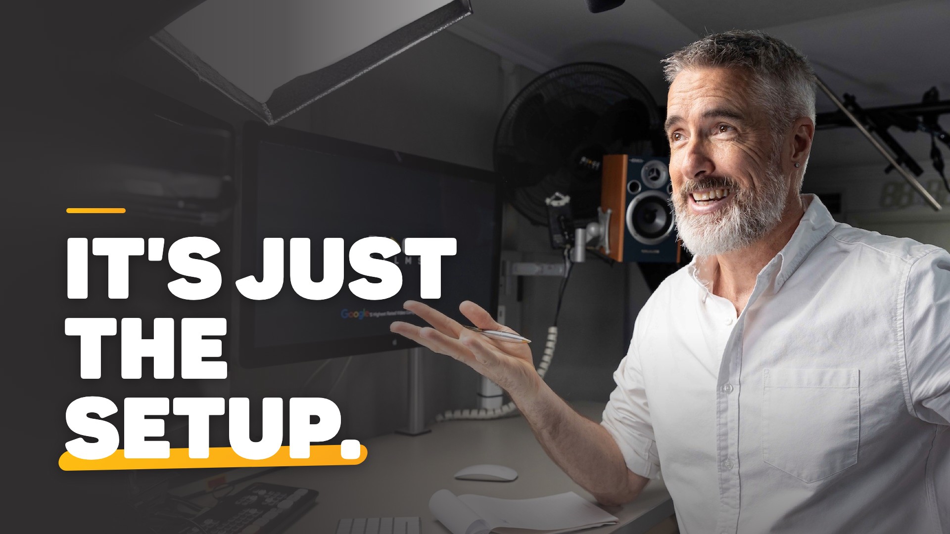 Chris Schwager smiling at his studio desk under a softbox light, with the words It's just the setup