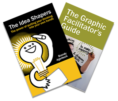 Small icon of Brandy's main 2 book. On top is the yellow and black cover of The Idea Shapers with an anthropomorphized lightbulb drawing rays coming off of it. Underneath is the green cover of The Graphic Facilitator's Guide