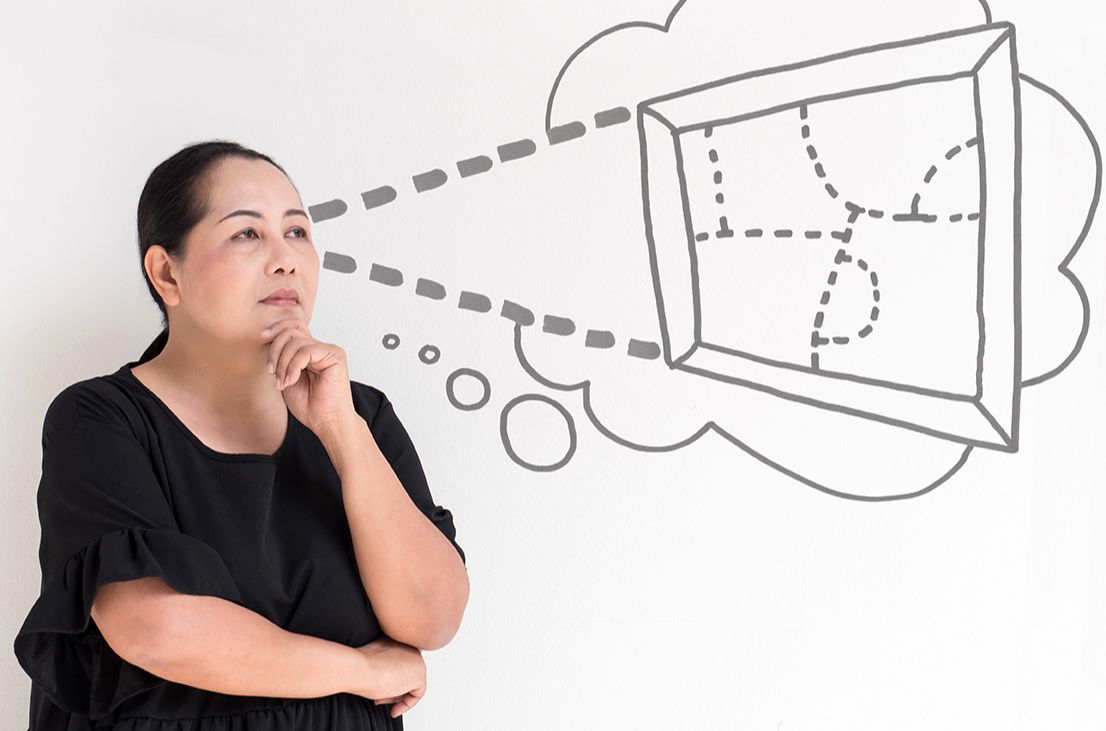 Thoughtful, frustrated woman with a thought bubble of half-formed ideas she can't get out of her head