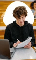 Graduate student writing notes in a lecture hall with a moving thought-shape around his head — visual note-taking for active learning and study focus