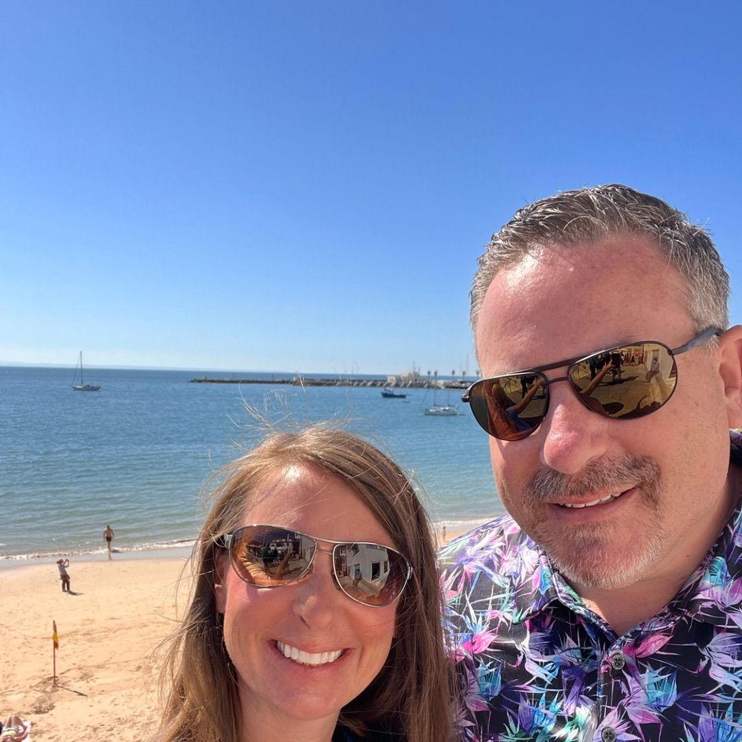 scott and melissa in cascais portugal in front of the beach