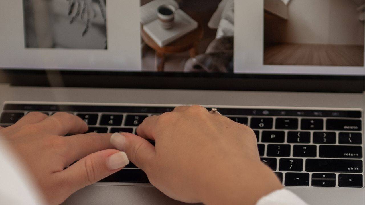 Woman founder building authority in business, reviewing her website on a laptop