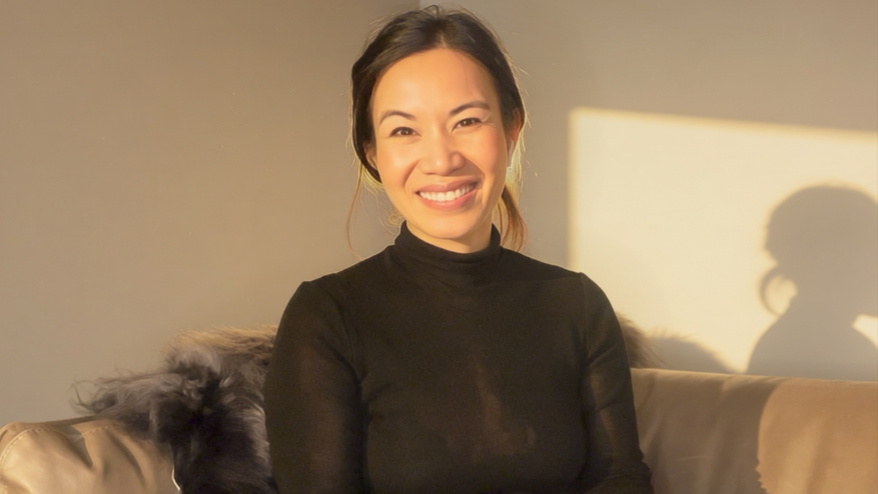 Dr. Kim Dang, transformational coach and former Yale professor, in a warm, natural portrait