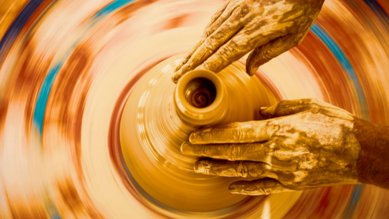 Potters Hands Carft a Pot on a Pottery Wheel