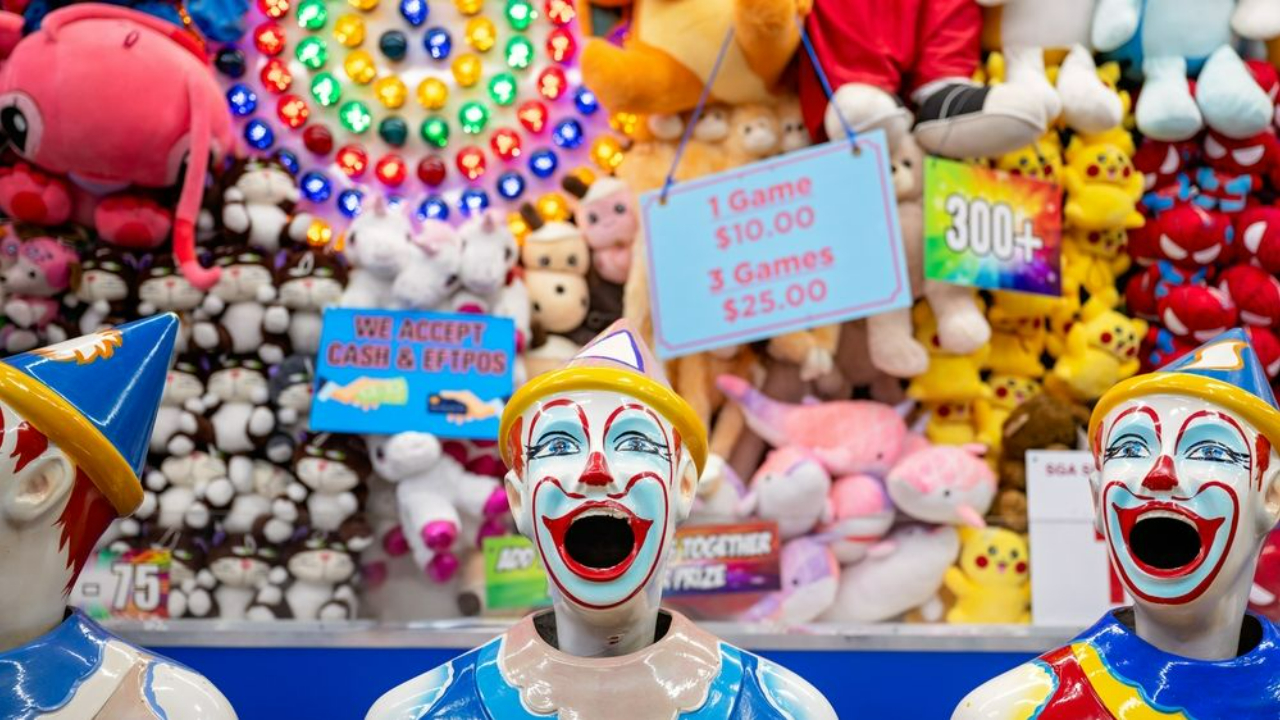 laughing clowns at carnival game with prizes