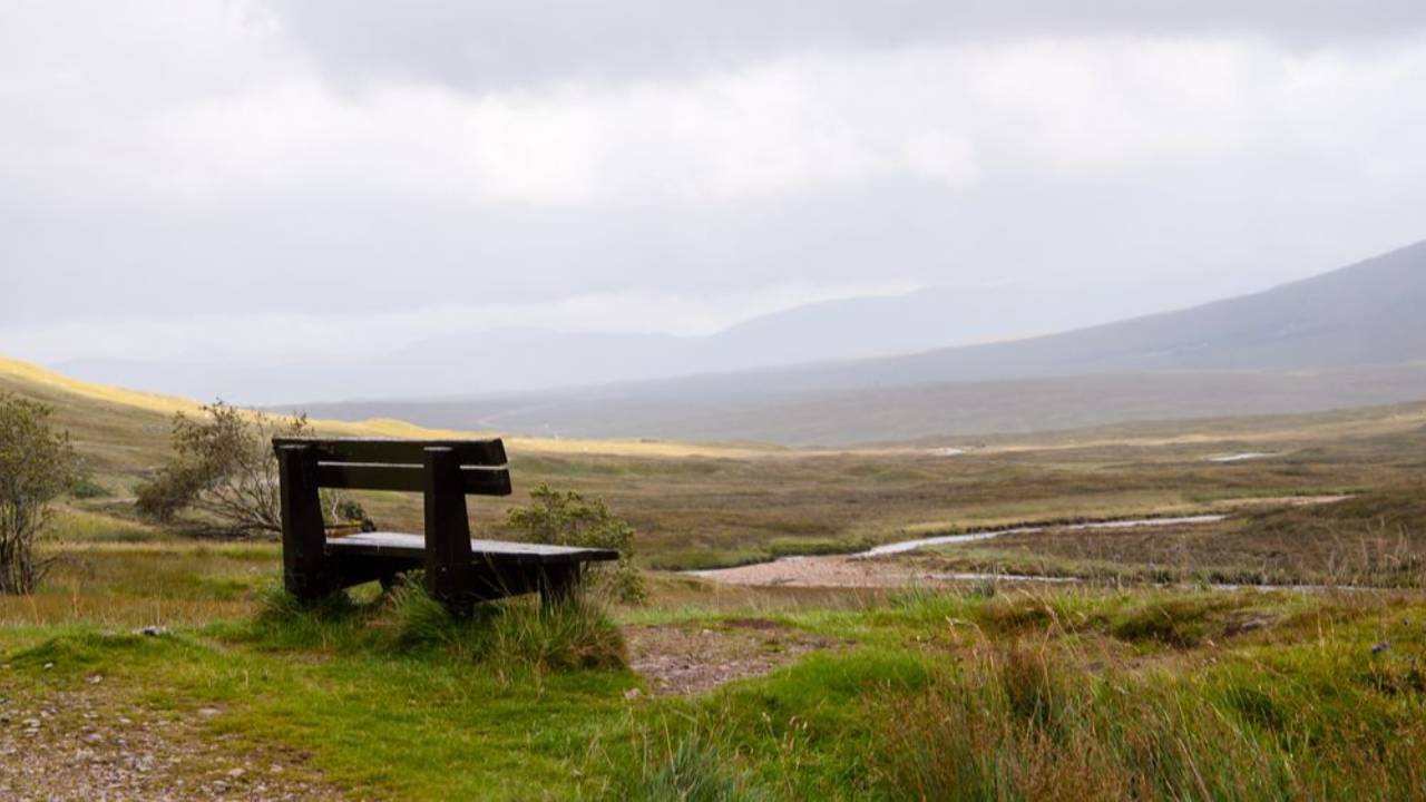 Bench overlooking Glencoe Scotland landscape