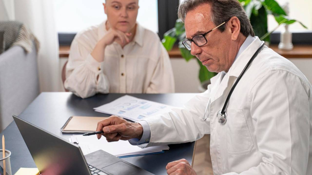 Doctor helping family member navigate wishes.