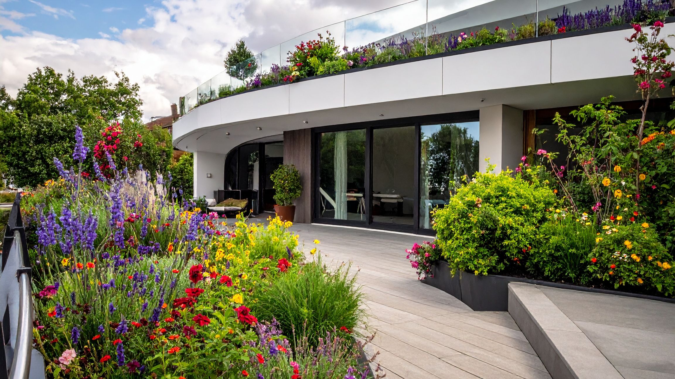 flowers plants displayed on balcony  can use recycled material water and lights