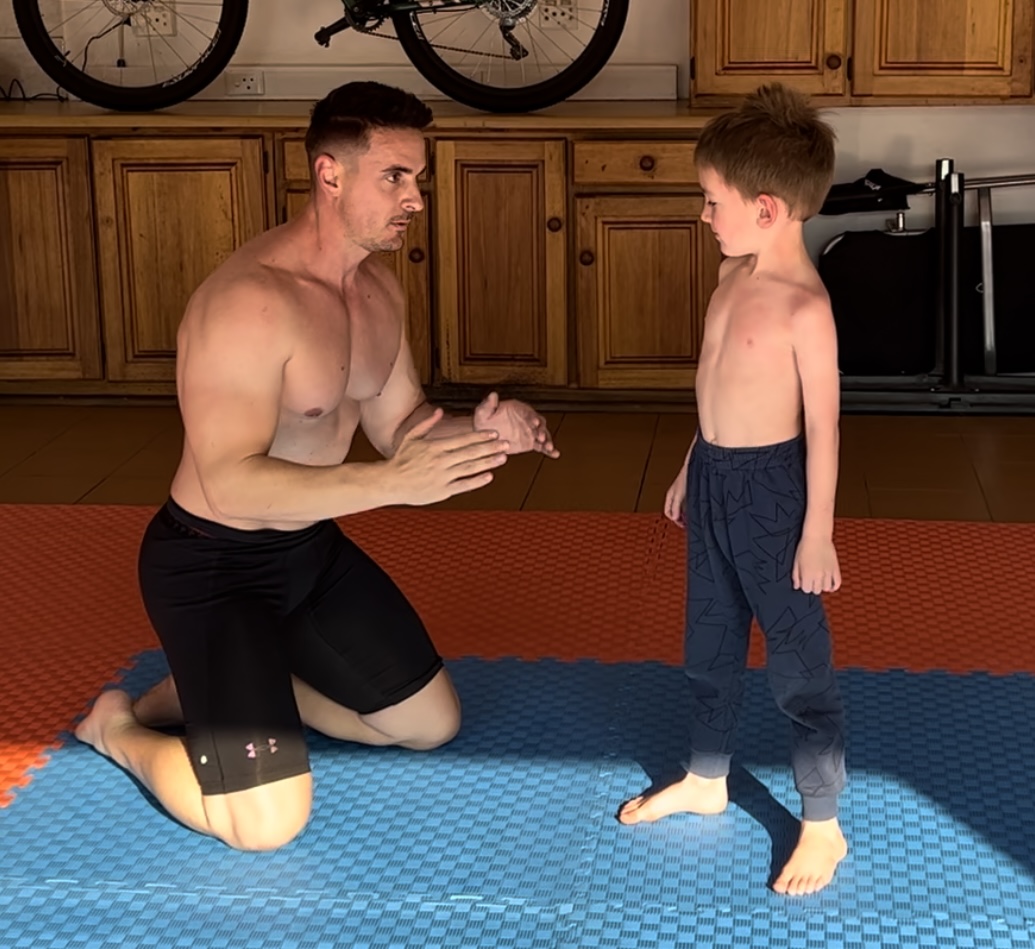 Jacque Visagie with his son wrestling