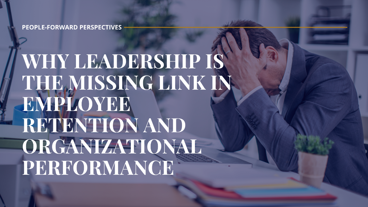 Male leader holding his head in frustration