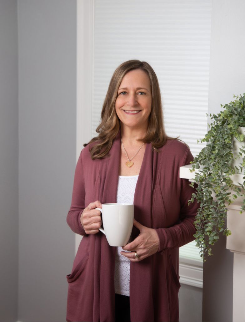 JoAnn Krall The Sensible Organizer holding a coffee mug