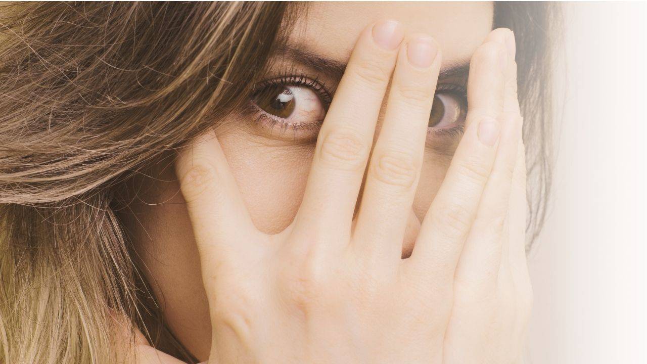 fear is real - girl hiding her face in her hands