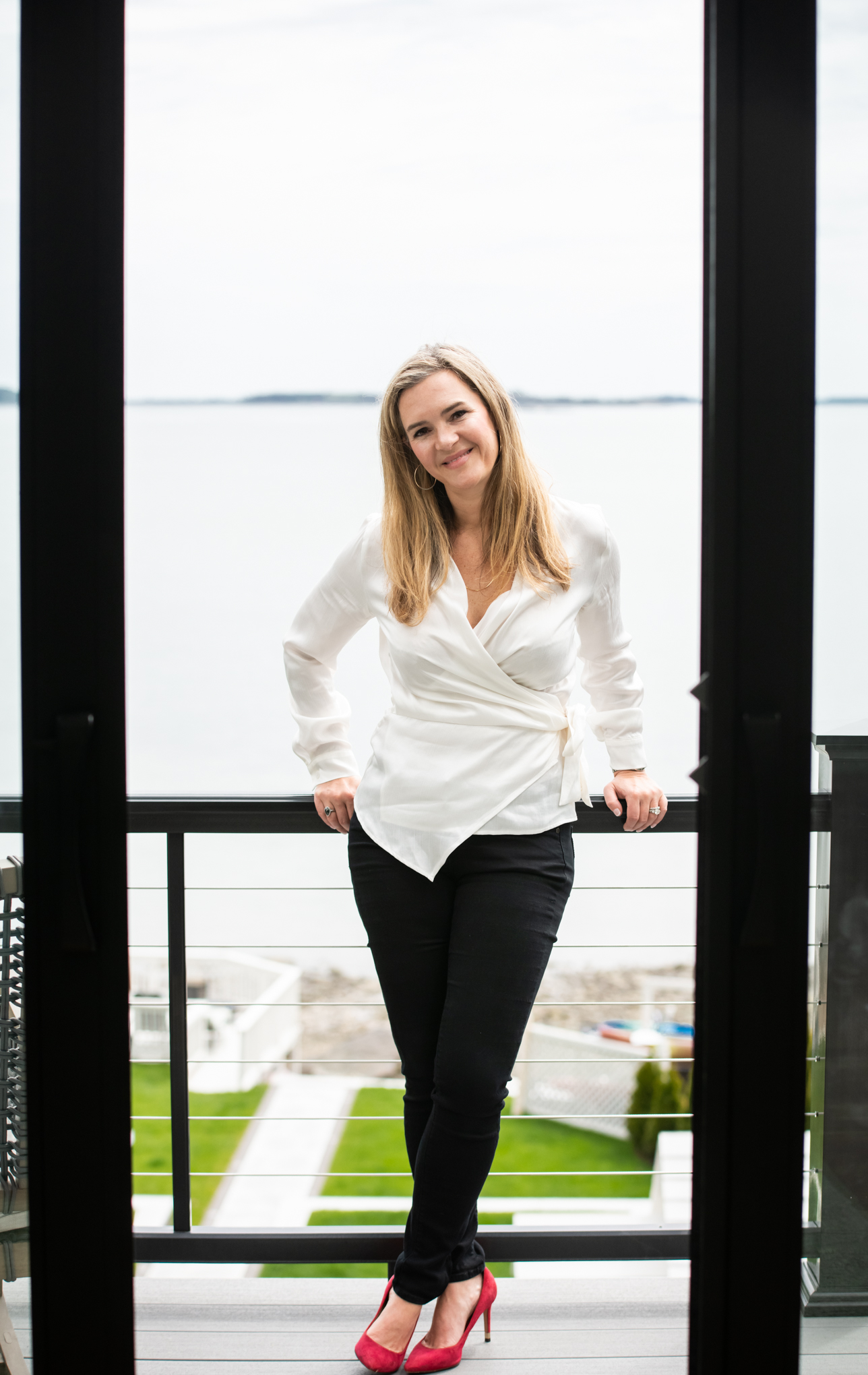 Dr. Jaclyn Smeaton standing in a white blouse
