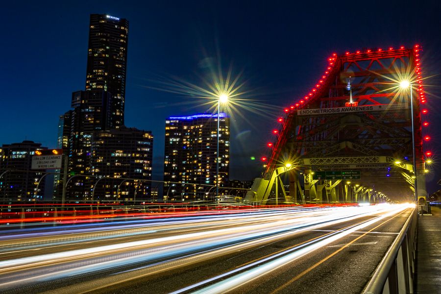 A double exposure photograph of hands over face