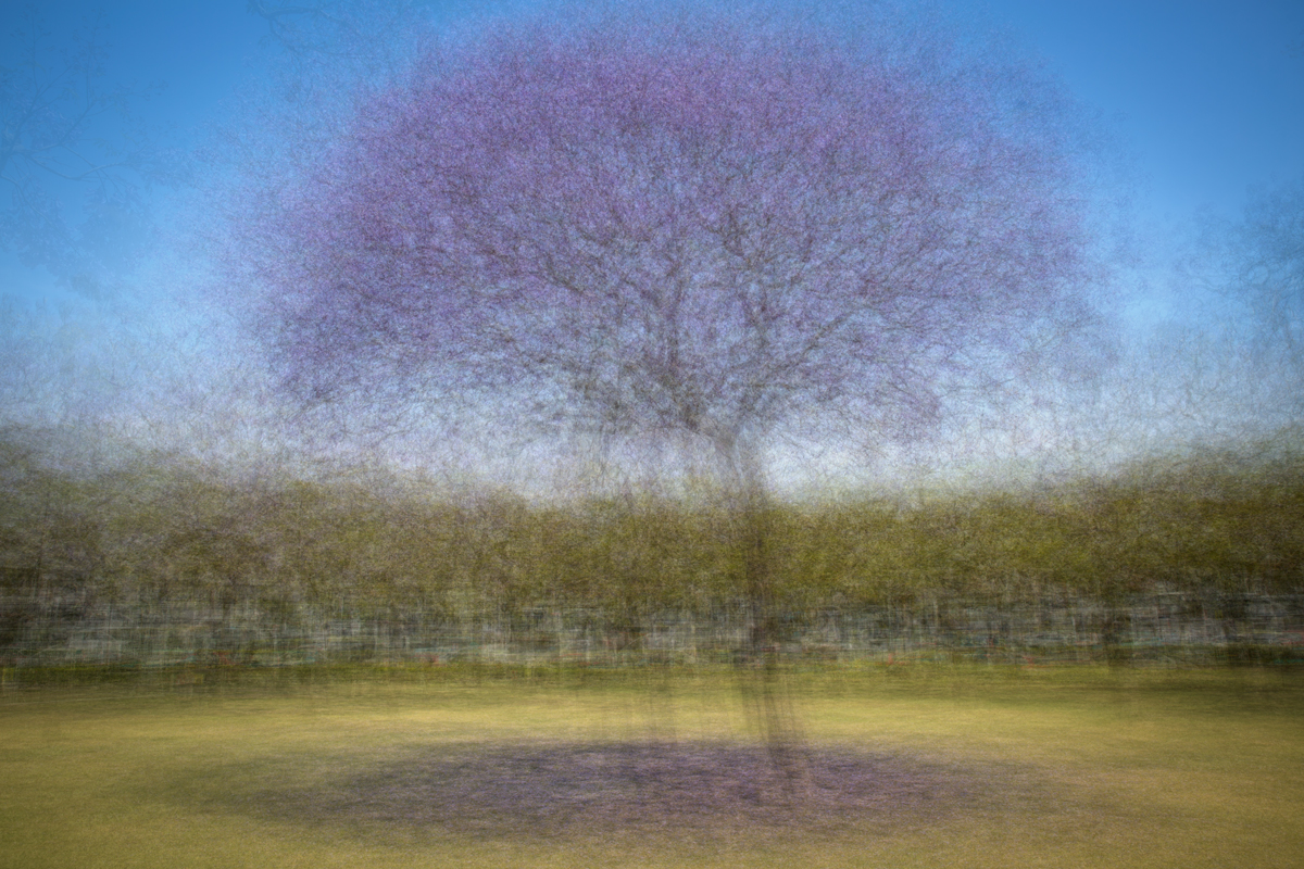 A photograph of a finger popping a soap bubble, a how to creative photography tutorial about how to take high speed bubble photography.