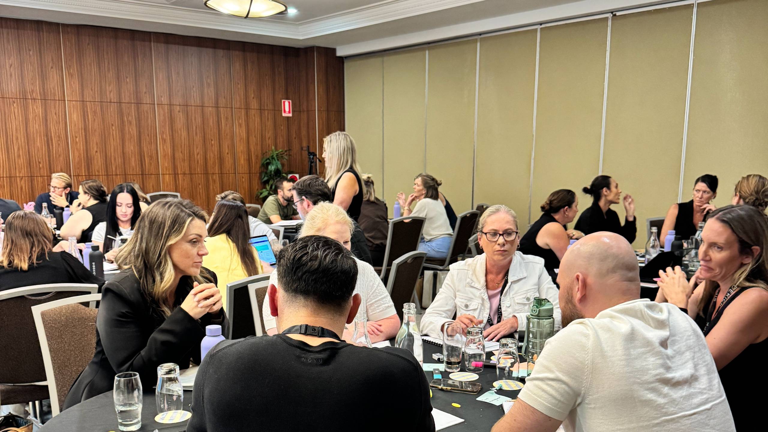 Property management business owners working together at a PMBA Intensive table