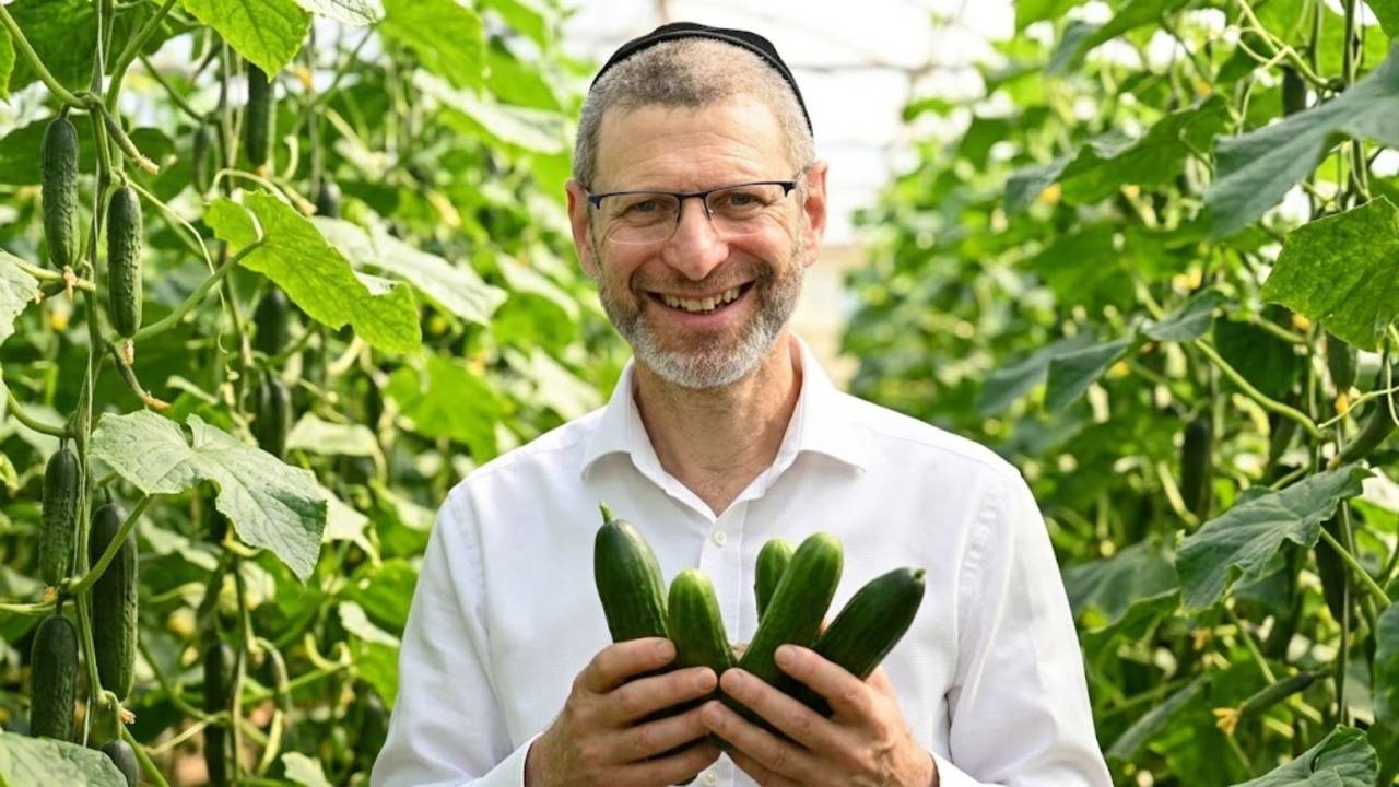 Dr Gundle holding a cucumber