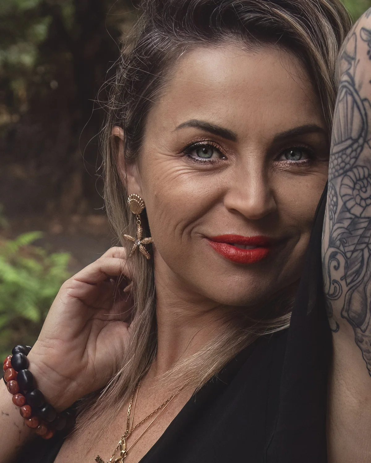 Victoria Bond smiling in the forest