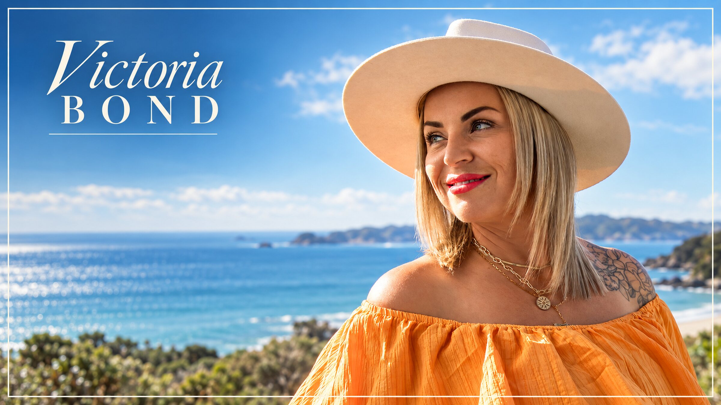 Victoria Bond smiling in a white hat at the beach, sunlit sea behind her