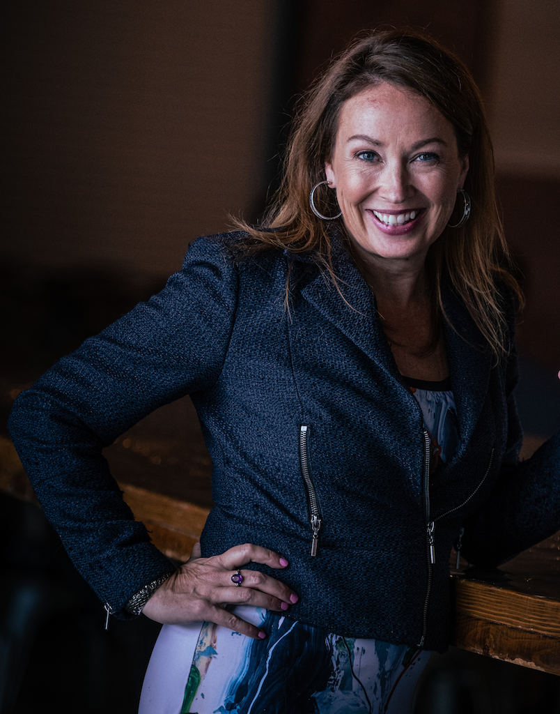 Jennifer Krueger smiling in a blue jacket