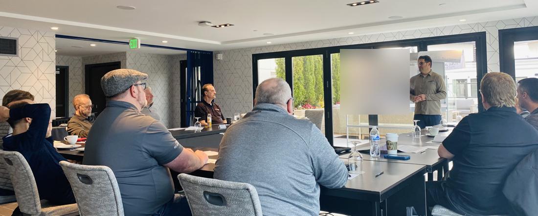 Adiel leading a strategic planning session with a leadership team
