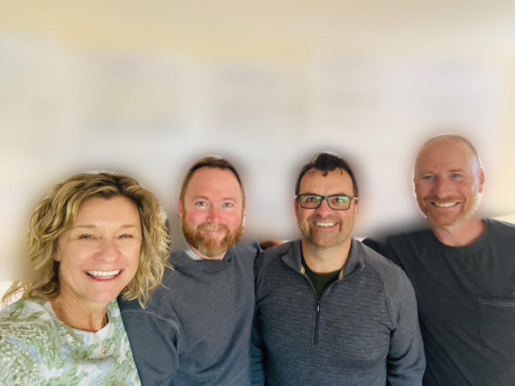 Adiel and Laura with a leadership team at an off-site retreat