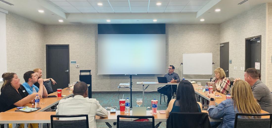 Adiel walking a leadership team through their strategic plan on screen