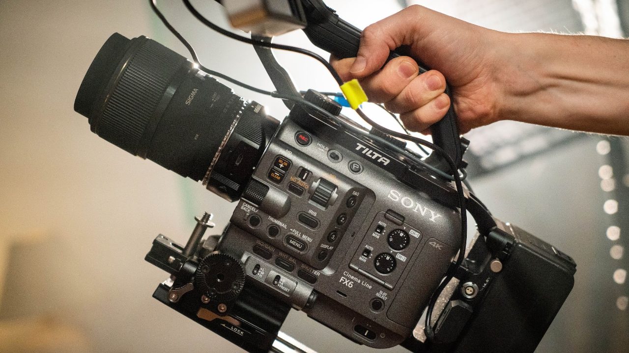 Sebastian Solberg using a documentary camera on location