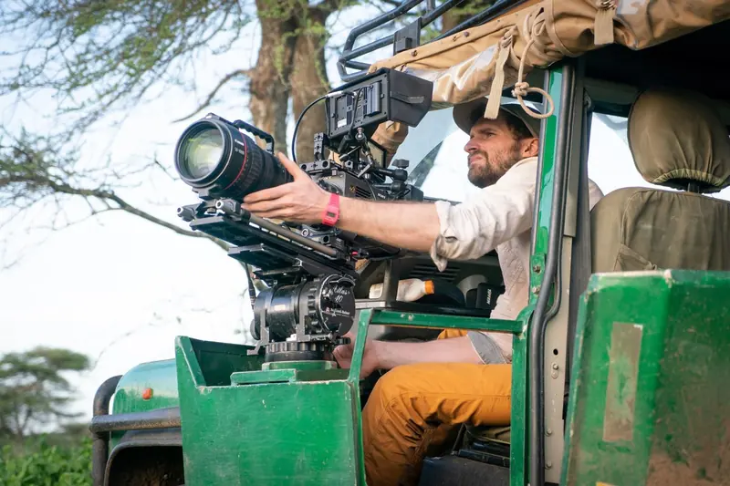 Filming with a long lens from the door of a Land Rover