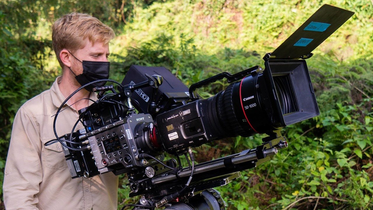 documentary camera angles - Sebastian Solberg filmmaker with camera in field