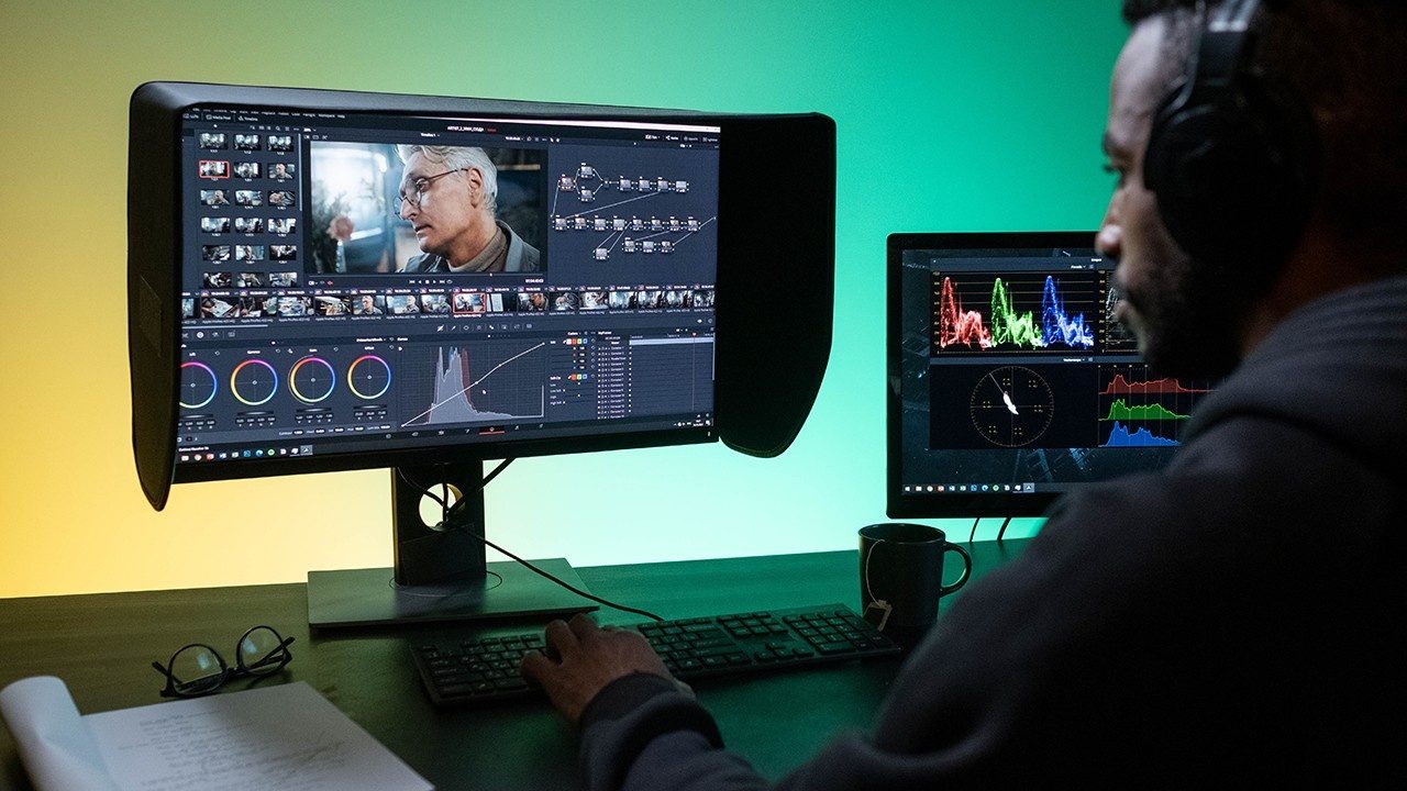 How to edit a documentary, filmmaker at editing workstation