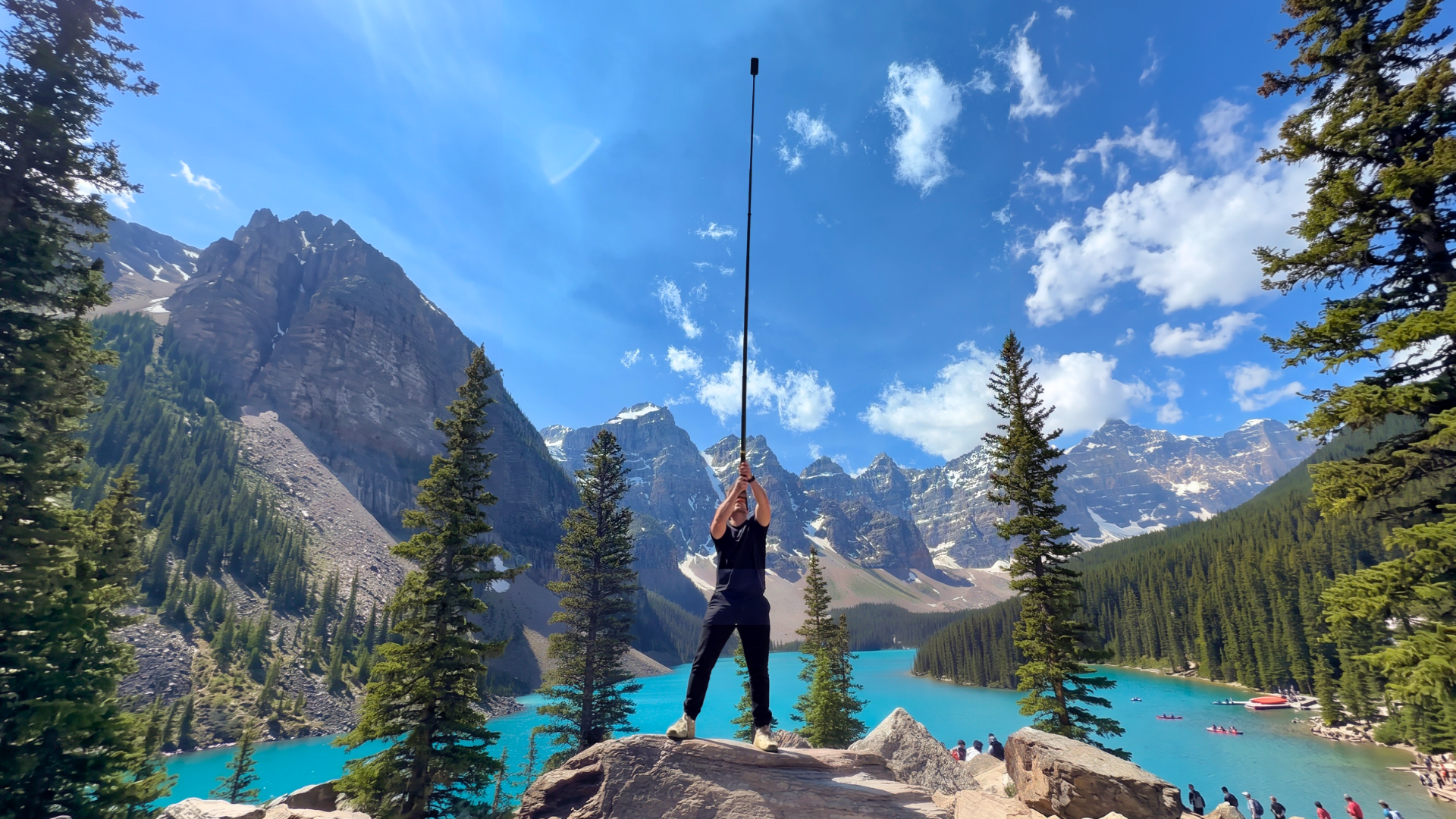 Ben filming with an Insta360 camera above Moraine Lake in the Canadian Rockies.