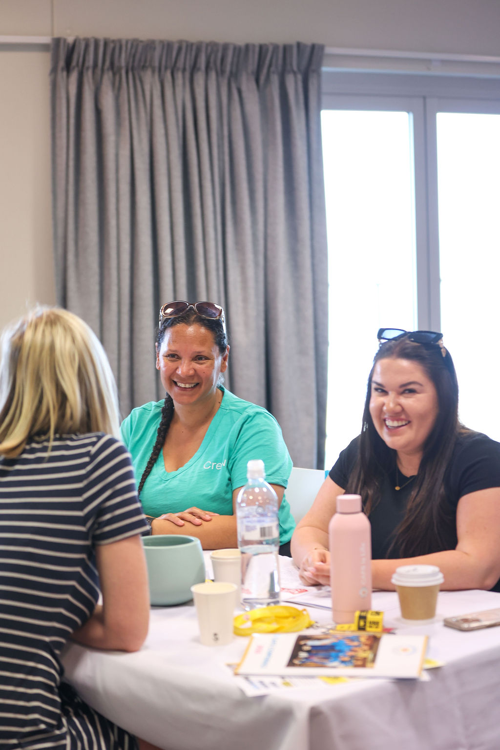 Teachers laughing together at the 2025 CAFS Conference