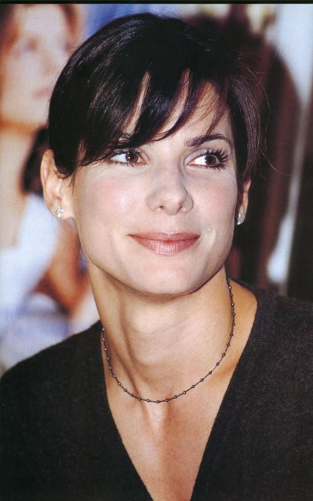 Sandra Bullock - a cis woman with a visible thyroid cartilage