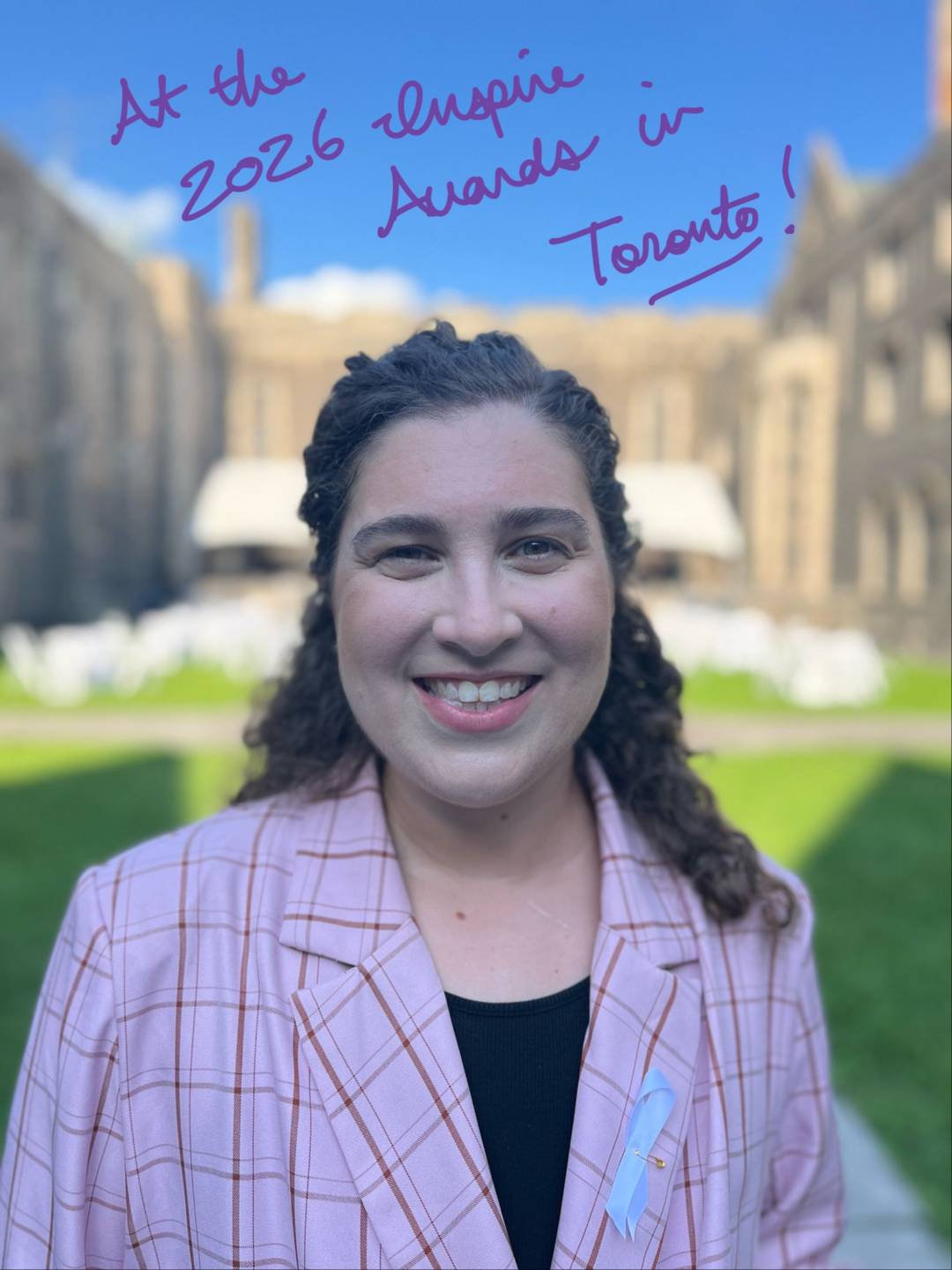 Ren&eacute;e in a pink suit, smiling beneath the text 