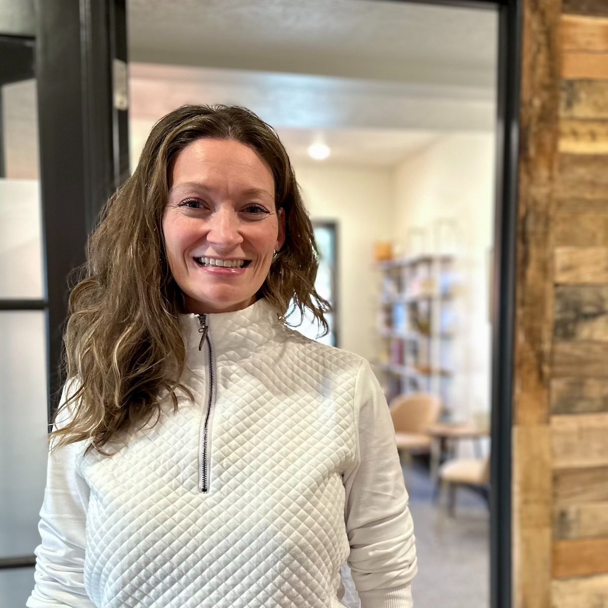 Dr. Mallorie Cracroft standing at the clinic entrance