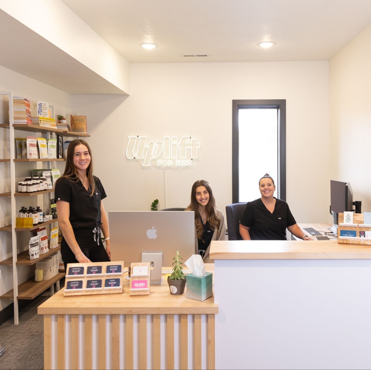 Uplift For Her front desk with staff