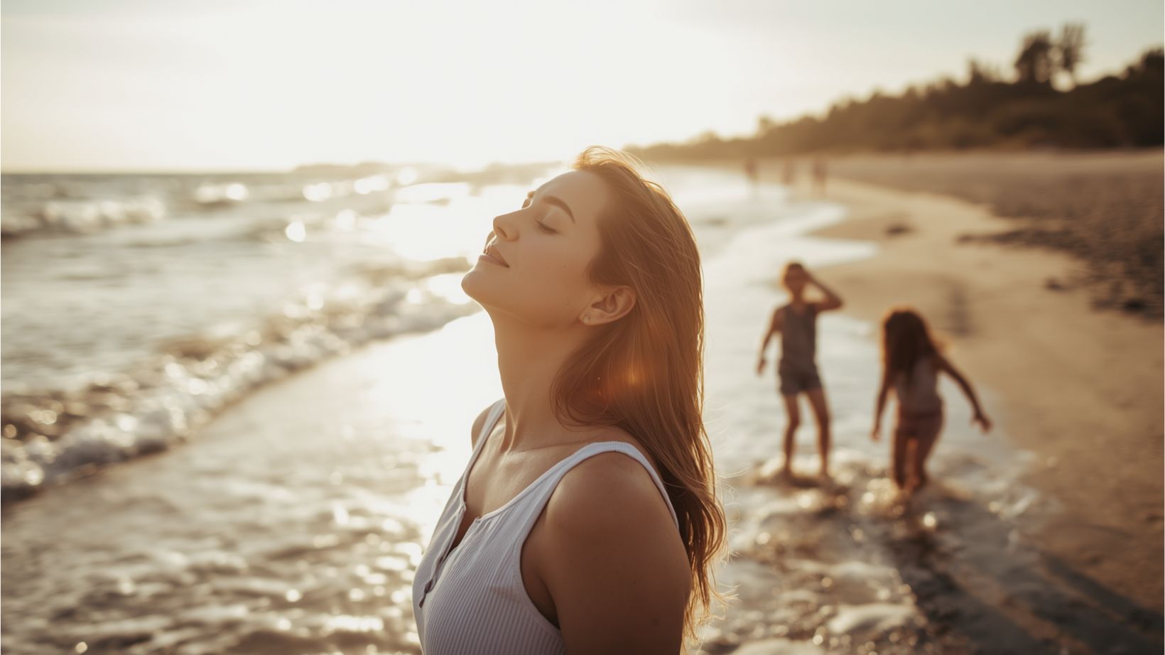 Mom breathing on beach while kids play in sand, representing nervous system regulation in summer