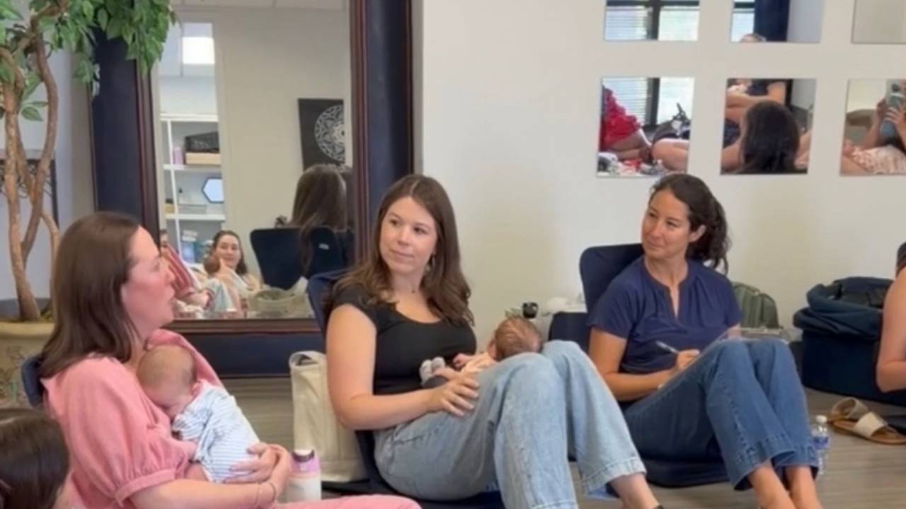 group of postpartum moms connecting over shared realities of motherhood