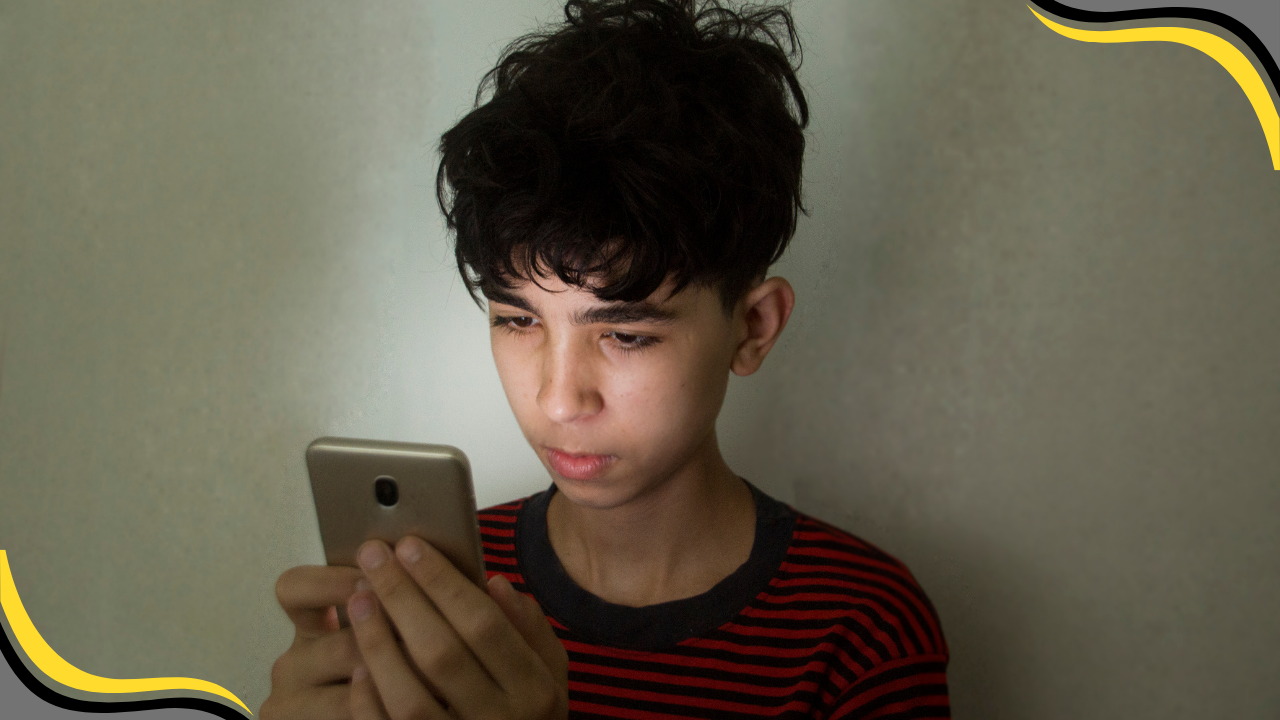 teenager looking at their phone
