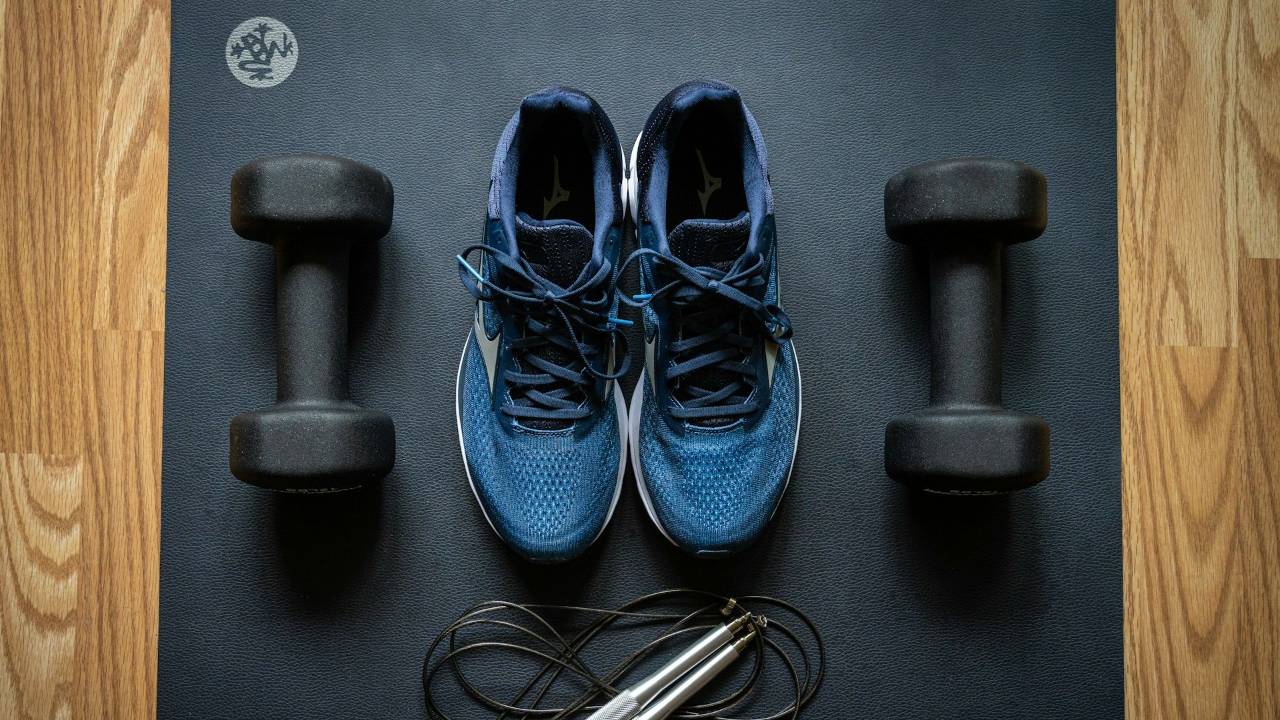 workout shoes, dumbbells, and a jump rope