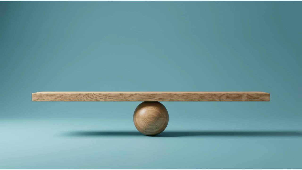 a piece of wood balances on a spherical wooden ball