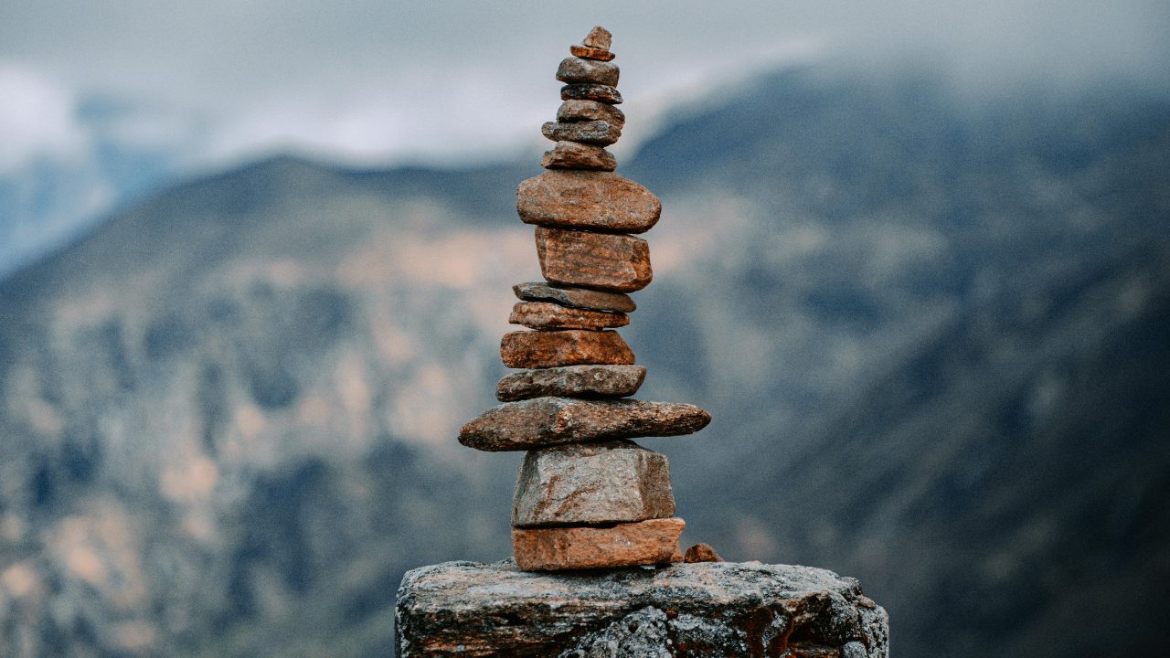 Stacked Stones on Sandy Beach