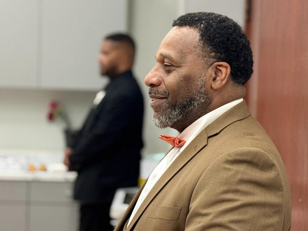 A man listening during a church gathering.