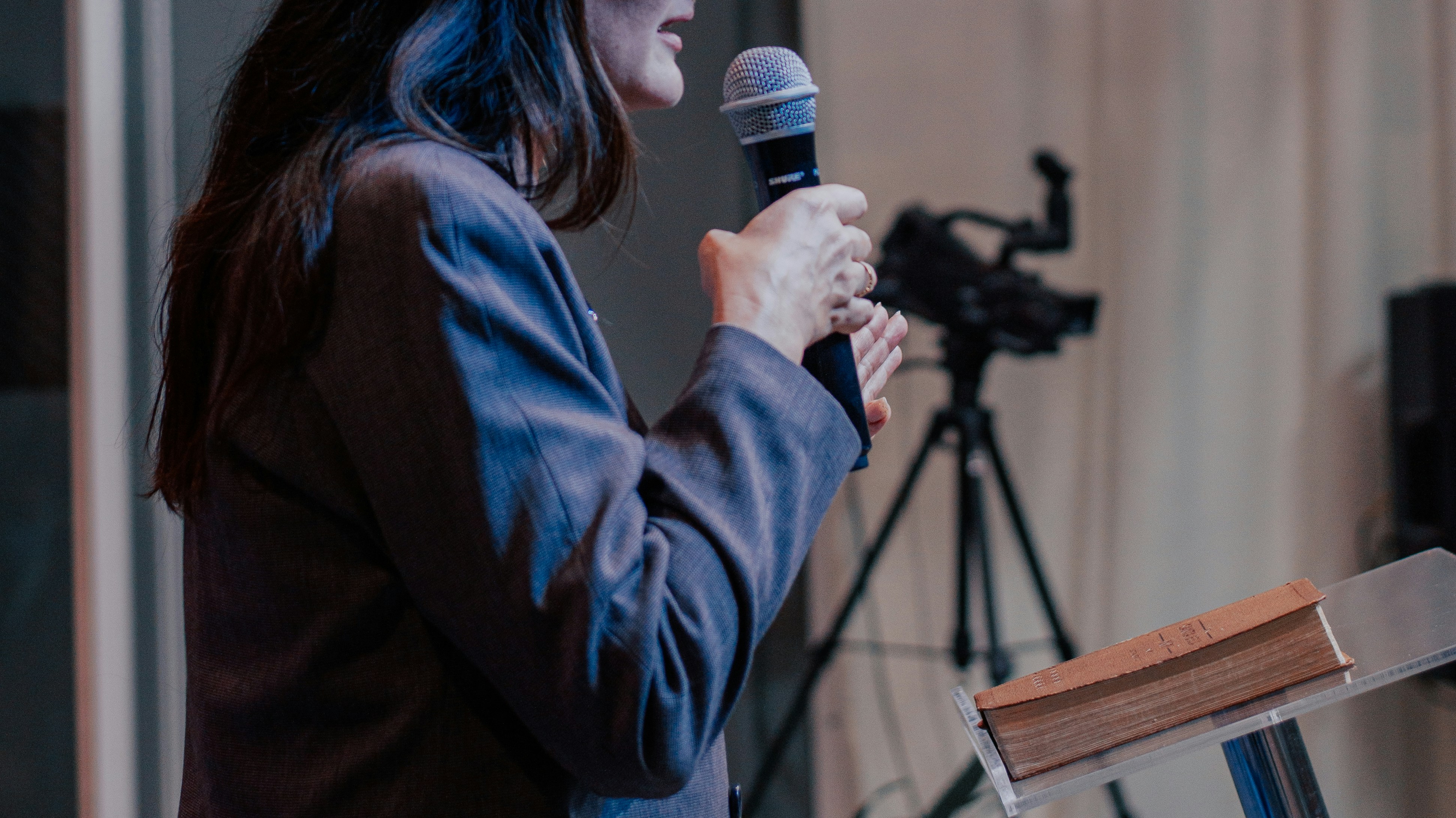 Nervous lady presenting with a microphone