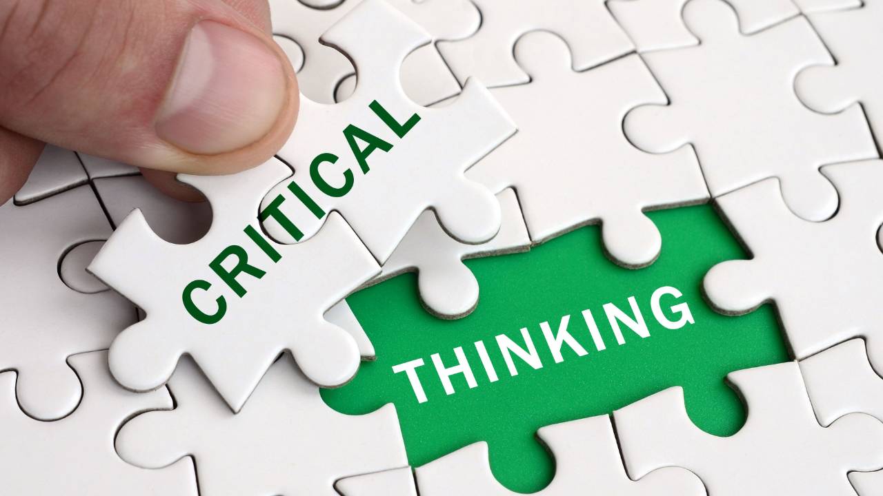 Puzzle pieces with the word Critical being inserted into blank space that says Thinking