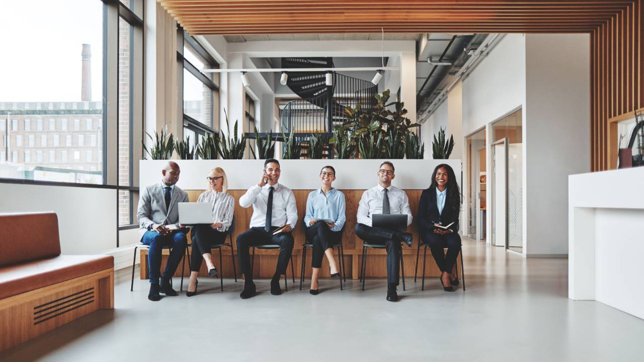Group of diverse candidates waiting in office for interview