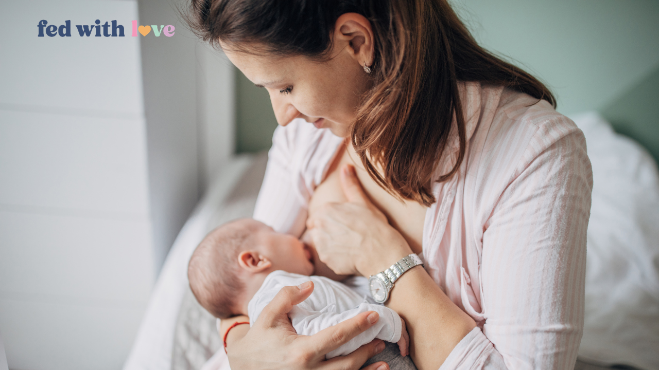 Mother breastfeeding a newborn baby during a cluster feeding session at home.