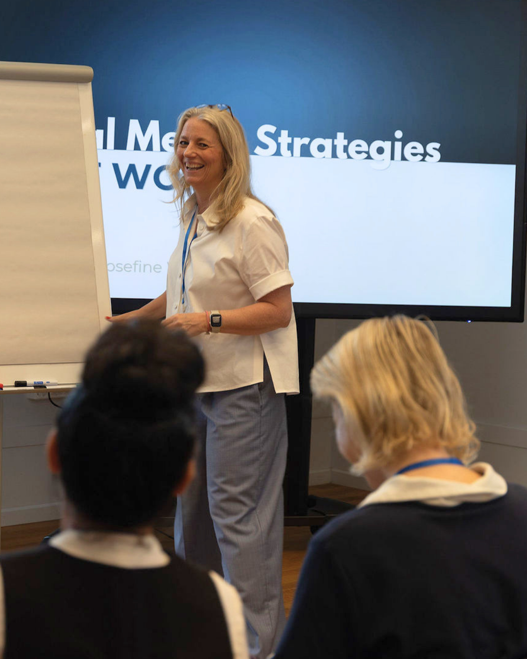 Josefine Wanner laughing while teaching an in-person workshop