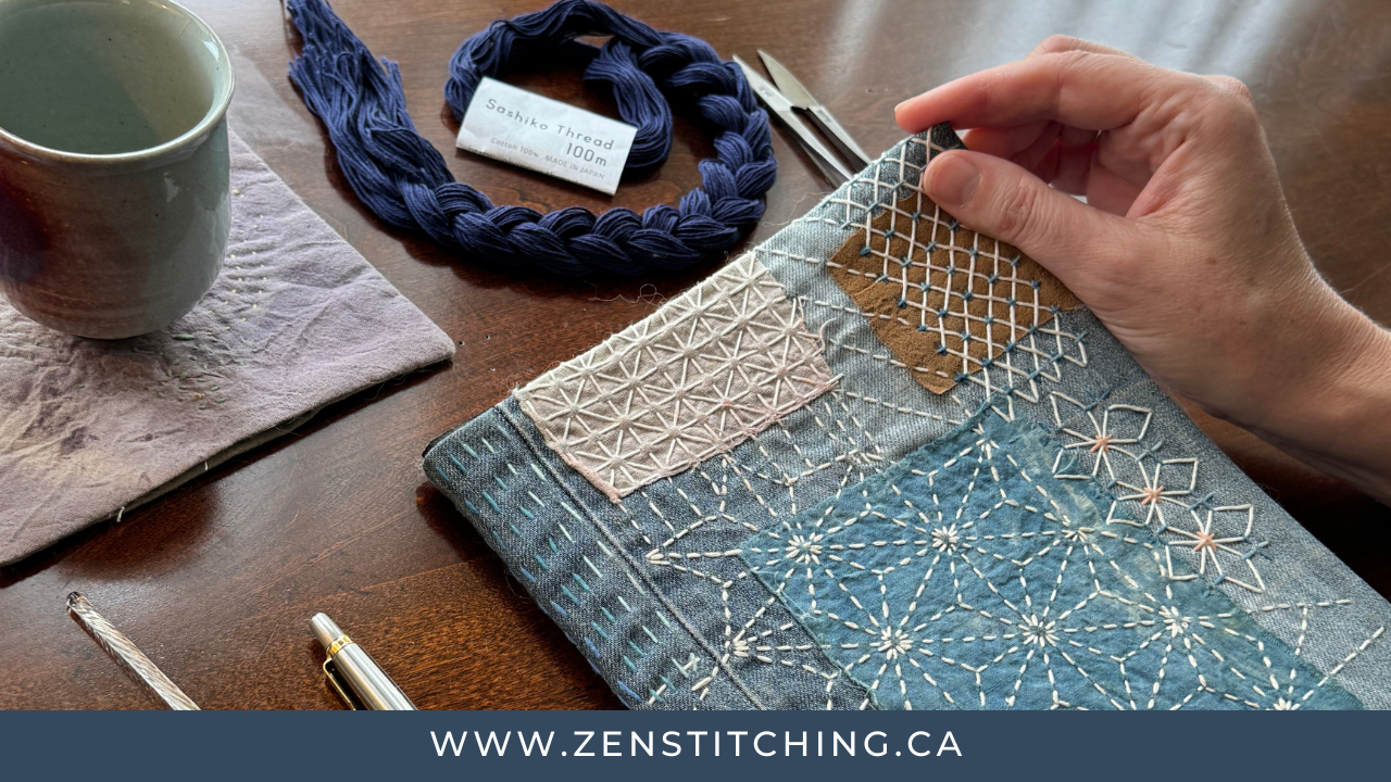 A hand is poised holding the corner of a stitched journal cover, ready to flip it open. The bottom of the photo reads "www.zenstitching.ca"